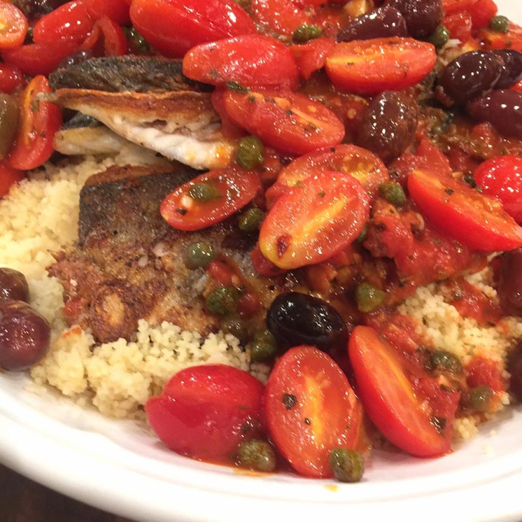 PAN SEARED BRANZINI WITH TOMATO CAPER SAUCE & COUSCOUS