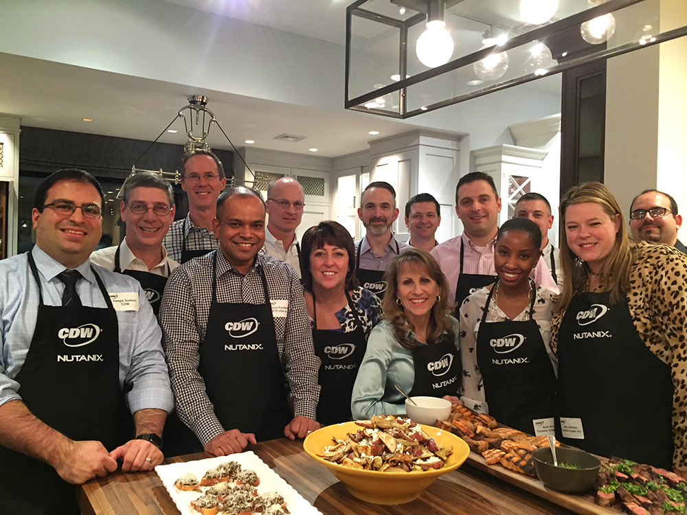 Corporate team posing for photo during cooking class